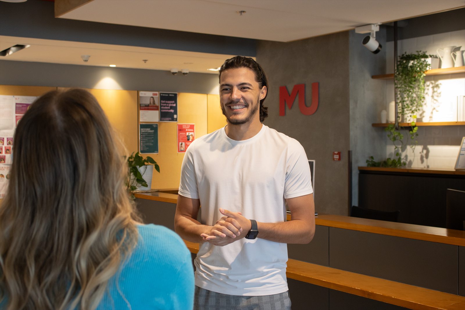 A Murdoch University Dubai team member helping a student with her next steps