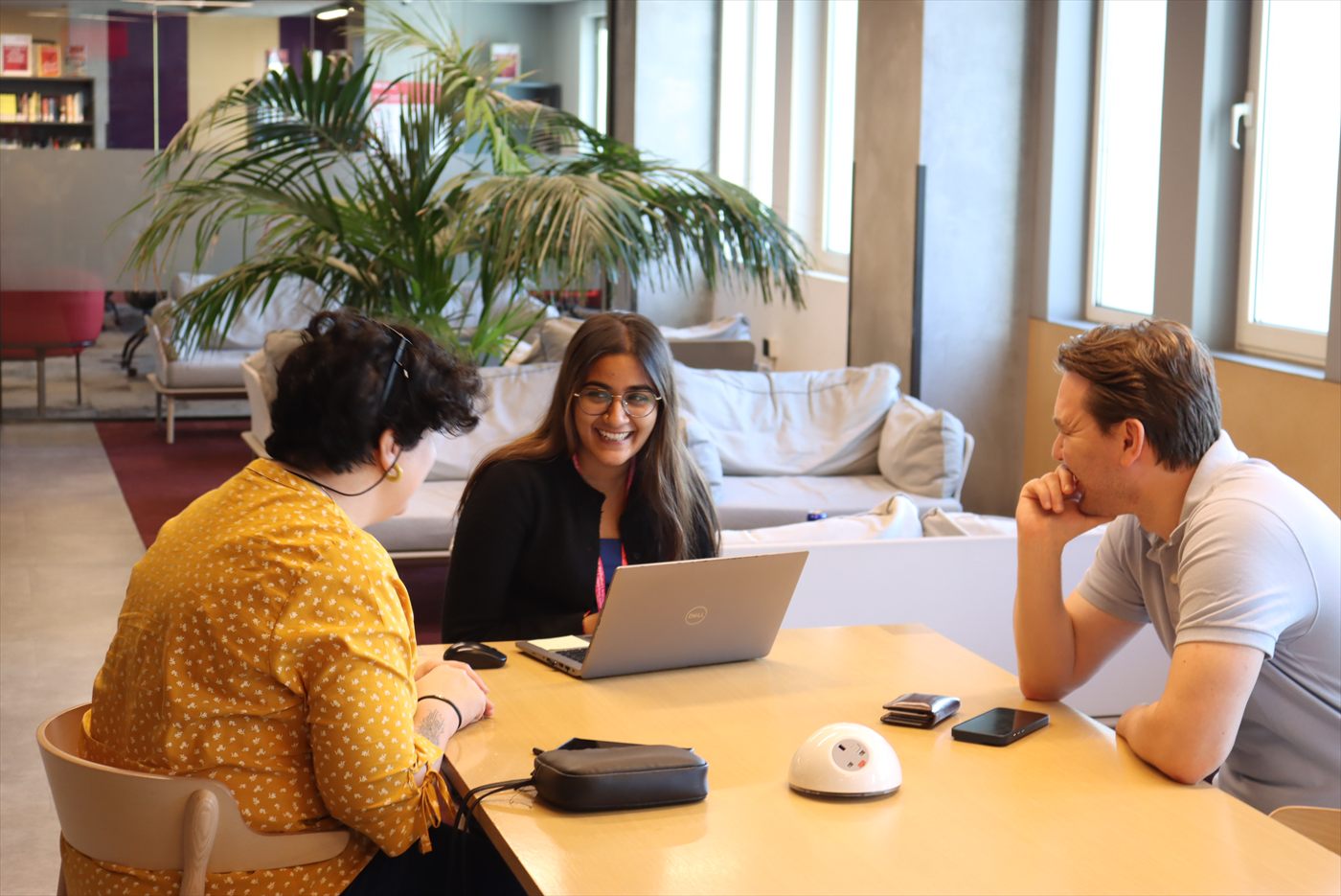A Murdoch University Dubai student working with classmates on campus